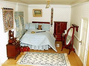 The 'second bedroom' with a needlepoint carpet and a wallhanging