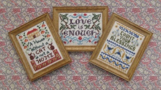 'Cat', 'Love is enough' and 'Count your blessings' miniature samplers - each measures two inches by two and a quarter inches. Available from www.janetgranger.co.uk