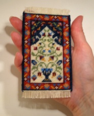 A doll's house scale prayer rug called 'Natalia', available as a kit from www.janetgranger.co.uk
