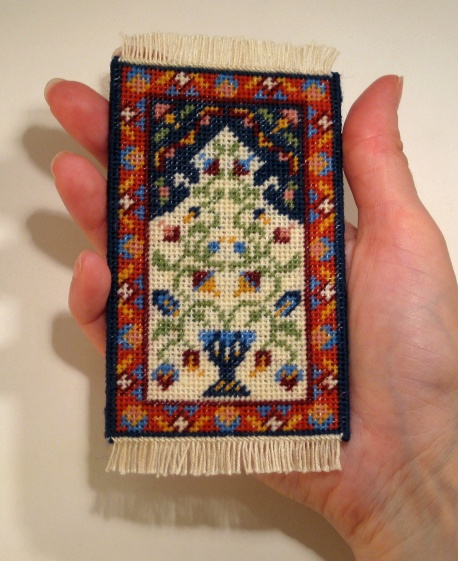A doll's house scale prayer rug called 'Natalia', available as a kit from www.janetgranger.co.uk
