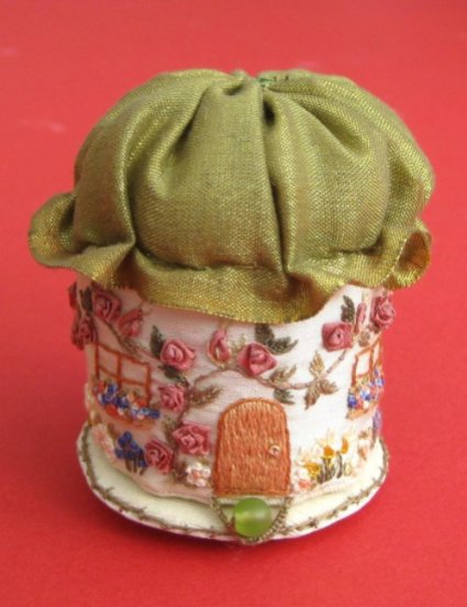 A pincushion 'Rose Cottage', by Carolyn Pearce